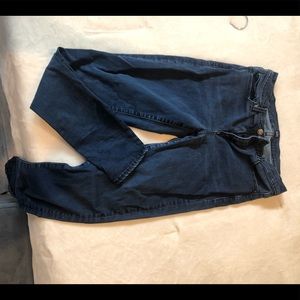 Dark blue denim skinny jeans.